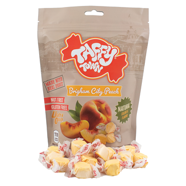 Taffy Town Brigham City Peach Taffy – limited-edition peach salt water taffy with individual wrapped pieces displayed in front of the 12oz pouch